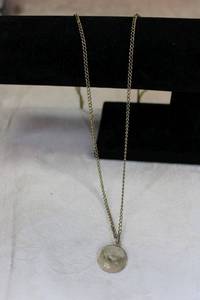 lot 83 image: Sterling Silver Virgo medallion pendant on 12K gold filled 34L necklace. Marked 120 12K