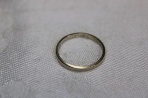 lot 104 image: 14K yellow gold band ring, Marked 14K. Size 7