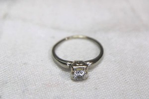 lot 109 image: 18K white gold and diamond vintage ring. Marked 18K. Single cut diamond. Size 7.5 Diamond tested.