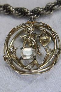 lot 77 image: Vintage German bracelet with cherub pendant with April heart dangle. Marked Germany. Non-magnetic (possibly 900 silver) Please preview