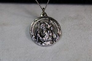 lot 78 image: Sterling Silver 24L necklace (marked sterling on clasp with St. Christopher sterling medallion (marked sterling)