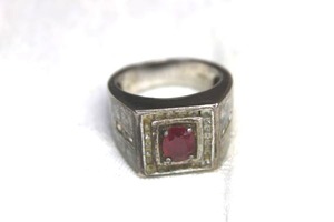 lot 66 image: Sterling Silver Ruby and white Topaz ring. Marked 925 FP. Size 10