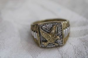 lot 69 image: Sterling Silver eagle ring with ribbed shoulders. Marked 925 inside. Size 10