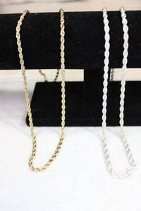 lot 51 image: (2) Necklaces. Gold necklace is 24K GB (Gold Bond). Both 24L. Both non-magnetic. Likely sterling but please preview. Unmarked.