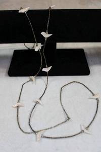 lot 56 image: Sterling liquid tube bead fetish necklace with carved Mother of Pearl birds. Barrel clasp. 48L Unmarked