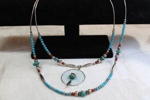 lot 57 image: Sterling liquid tube and Turquoise and Carnelian necklace with dream catcher pendant. Barrel clasp. 20L Unmarked Overall length 26L