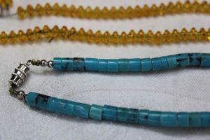 lot 58 image: Sterling Silver faux Citrine 24L necklace with sterling clasp. Marked Sterling. Includes a Turquoise bead necklace with a barrel clasp. 16L