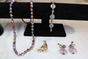 lot 41 image: Travel souvenir jewelry. Millefiori Italian art glass bead necklace 24L, Venetian wedding bead and Sommerso vintage screw back earrings, Micro mosaic Italian MCM bracelet 8L, Toledo Spain Damascene sail boat pin