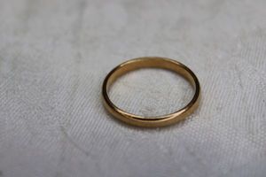 lot 30 image: 14K yellow gold band ring. Marked 14K. Size 10.5
