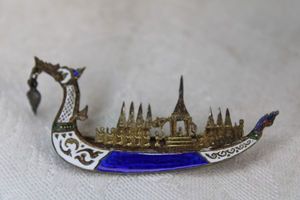 lot 36 image: Sterling Silver enamel figural barge ship brooch. Marked Sterling Siam. 2.5L