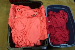 lot 152 image: Pink and bright pink tableclothsskirtslinens - 2 totes