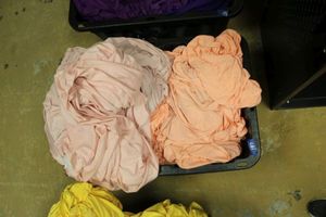 lot 147 image: Light orange or peach tableclothsskirtslinens - 1 tote