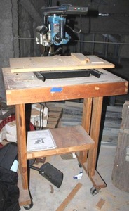 lot 125 image: Ryobi 8-14 Radial Arm saw and rolling table stand