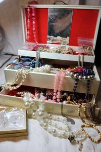 lot 27 image: MCM jewelry box with assorted fashion jewelry selection.
