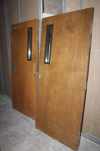 lot 126 image: 2 Solid wood doors. Same size with small window. Needs hardware. HEAVY