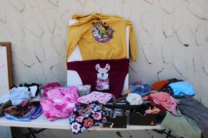 lot 40 image: Kids clothes (multiple sizes) and shoes