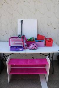 lot 41 image: Kids Bicycle helmet and toys (includes Barbie) and toy shelf