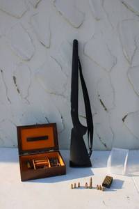 lot 63 image: Gun stock and ammo, see photos