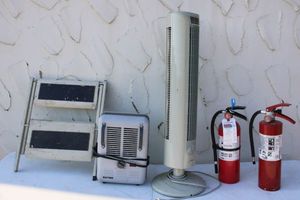 lot 65 image: Fire extinguishers, tower fan, heater, and step stool
