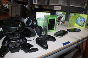 lot 173 image: Gaming controllers, PSVitas, Xbox games (Controller box is empty)