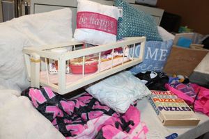 lot 185 image: Decorative pillows, doll cradle, puzzle book and more
