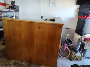 lot 59 image: L-shaped front entry or reception counter - wood with laminate top. Sections come apart.