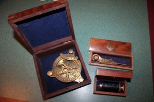 lot 18 image: Nautical lot Compass, Telescope and Boatswain whistle each in wooden boxes with brass inlay.