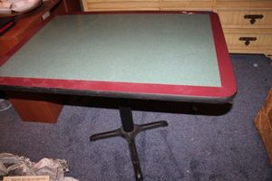 lot 16 image: 3x4 Dining table with cast iron base. Matches lot 327.