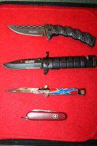 lot 21 image: Utility knives with case. Two are TAC-FORCE, See photos.