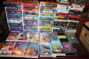 lot 36 image: Generous collection and VHS tapes (mostly Disney movies)