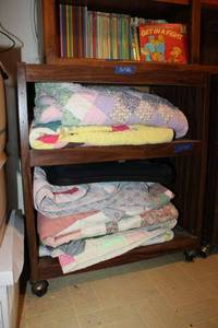 lot 65 image: Quilts and blankets. Plus lap pad
