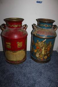 lot 87 image: Pair of metal milk jugs with Wine Guide dcor
