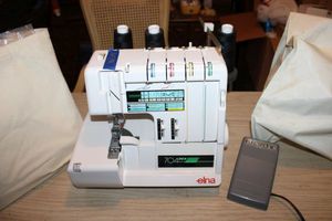 lot 140 image: Elna Sewing machine with foot pedal