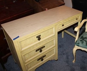 lot 131 image: Dixie furniture desk. Has Shangri-La stamp and dovetail drawers with yellow finish.