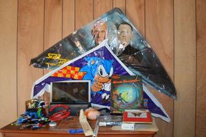 lot 160 image: Misc. lot Sonic and Star Trek kites, Pac-Man and Stryper posters, Lego ship and more