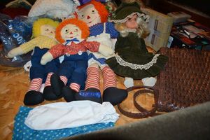 lot 154 image: Raggedy Ann and Andy dolls, Girl doll with green dress and hat