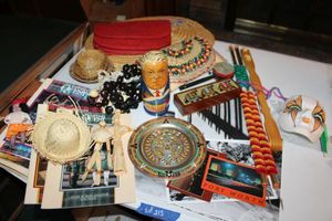 lot 213 image: Souvenir collection - including porcelain face mask, Russian nesting doll, jewelry box with inlay elephants, see photos