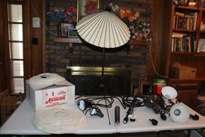 lot 209 image: Portable tripod lights, clip-on desk lights, paper lanterns