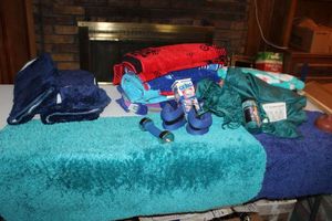 lot 207 image: Swimming towels, ankle weights, shower curtain with cat shower hooks, bathroom rugs