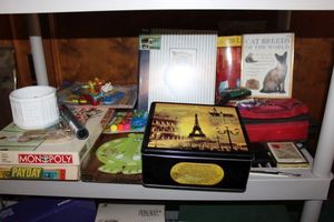 lot 219 image: Cats and kids lot board games, art supplies, photo album, cat breeds book, cat collars and more