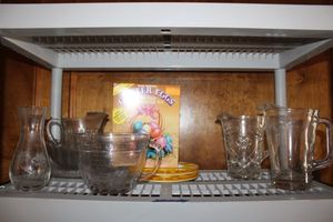 lot 217 image: Clear glass beer pitchers, 8 cup measuring cup, Egg decorating kit and egg plates relish platter and more