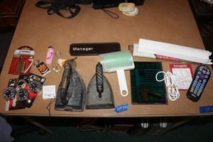 lot 191 image: Vintage cast iron sad irons, padlocks, universal remote, incense sticks, lint roller