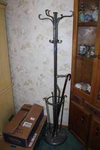 lot 250 image: Iron coat rack and umbrella stand with walking canes