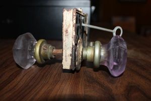 lot 242 image: Antique doorknob and key with purple glass doorknobs