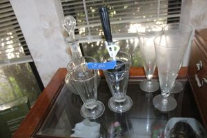 lot 266 image: Ice cream sundae dishes with scoop, clear glass wine decanter