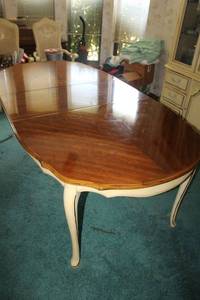 lot 289 image: French style Dining table. Has one leaf shown in picture, table has glossy finish on top. Protective cover included.