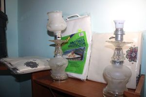 lot 297 image: Vintage pair of desk lamps, unopened curtains and baby mattress cover