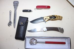 lot 306 image: Knives Imperial, Razor Tactical spider knife, Swiss Army knives, Letter opener, and extension back scratcher.