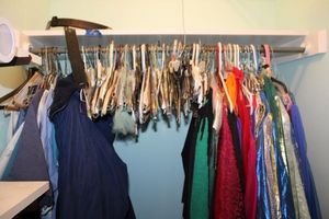 lot 313 image: Belly dancing costumes, womens scrubs, Blue winter lined coat, wolf buckle leather belt