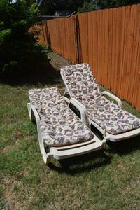 lot 331 image: Pair of plastic patio lounge chairs with cushions
